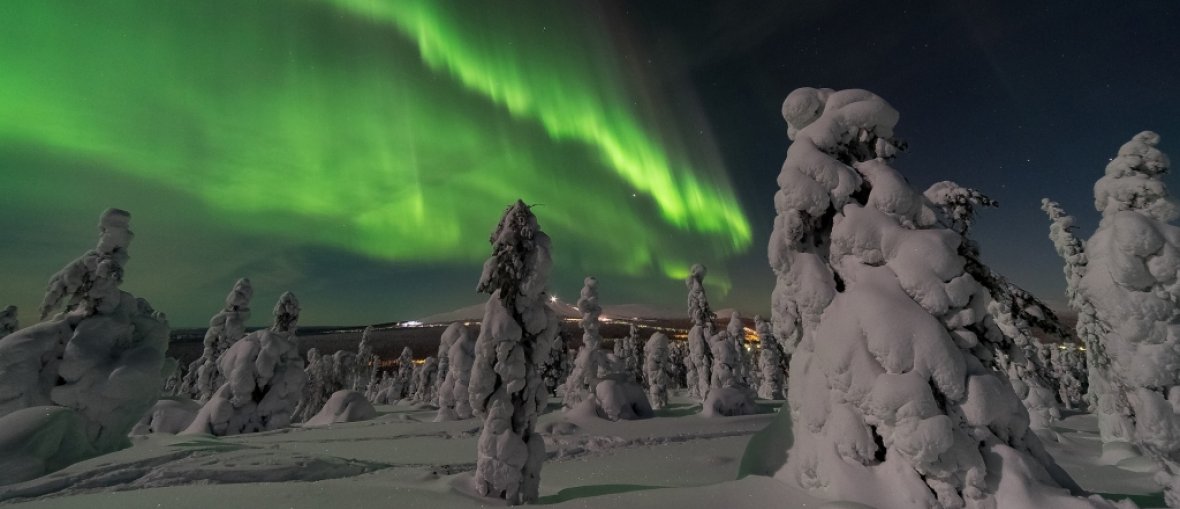 Viagem para Finlândia - Aurora Boreal na paisagem de inverno